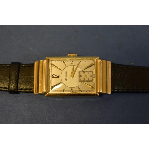 127 - A 1940s Jaeger LeCoultre 14k gold tank wristwatch, having bi-coloured and subsidiary seconds dial, 4... 