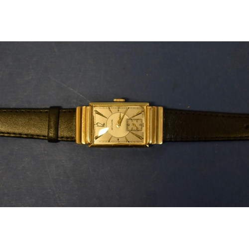 127 - A 1940s Jaeger LeCoultre 14k gold tank wristwatch, having bi-coloured and subsidiary seconds dial, 4... 