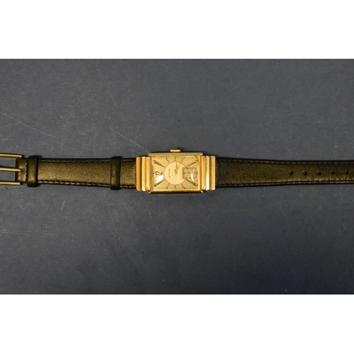 127 - A 1940s Jaeger LeCoultre 14k gold tank wristwatch, having bi-coloured and subsidiary seconds dial, 4... 