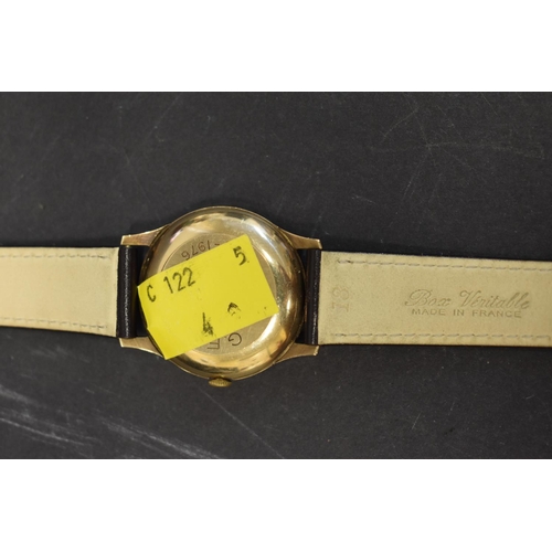 123 - A Garrard 9ct gold gentlemans automatic wristwatch, hallmarked London 1974, 34mm case, on leather st... 