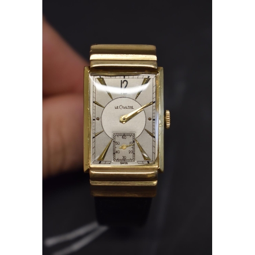 127 - A 1940s Jaeger LeCoultre 14k gold tank wristwatch, having bi-coloured and subsidiary seconds dial, 4... 