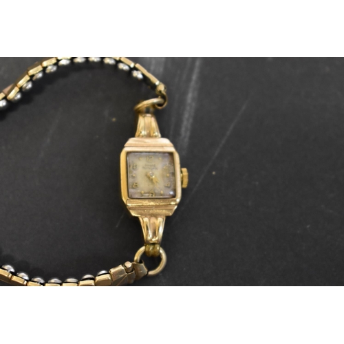 131 - A Girard Peregaux 9ct gold ladies wristwatch, on expanding plated bracelet; together with  a propell... 