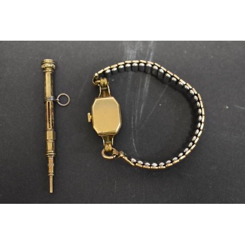 131 - A Girard Peregaux 9ct gold ladies wristwatch, on expanding plated bracelet; together with  a propell... 