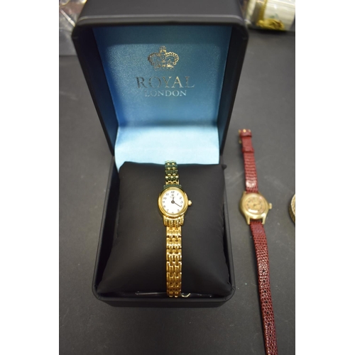 138 - A Royal London gold plated ladies quartz wristwatch, boxed; together with two other similar examples... 