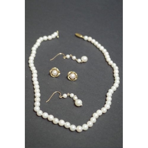 149 - A string of cultured pearls having 9ct gold clasp; together with two pairs of unmarked pearl earring... 