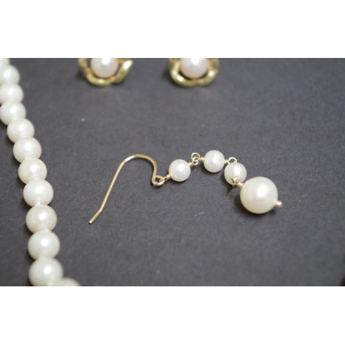 149 - A string of cultured pearls having 9ct gold clasp; together with two pairs of unmarked pearl earring... 