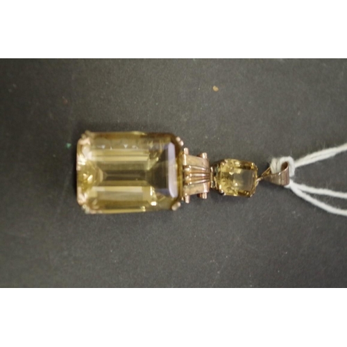 150 - A large rectangular citrine pendant with smaller citrine above, having unmarked swivel mount, 20mm x... 