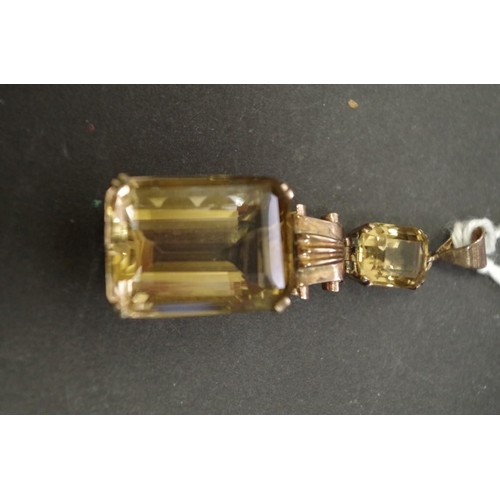 150 - A large rectangular citrine pendant with smaller citrine above, having unmarked swivel mount, 20mm x... 