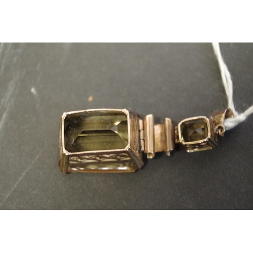 150 - A large rectangular citrine pendant with smaller citrine above, having unmarked swivel mount, 20mm x... 