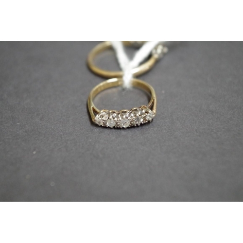 154 - An 18ct gold five stone diamond ring; together with a 9ct illusion set diamond ring, (2).... 