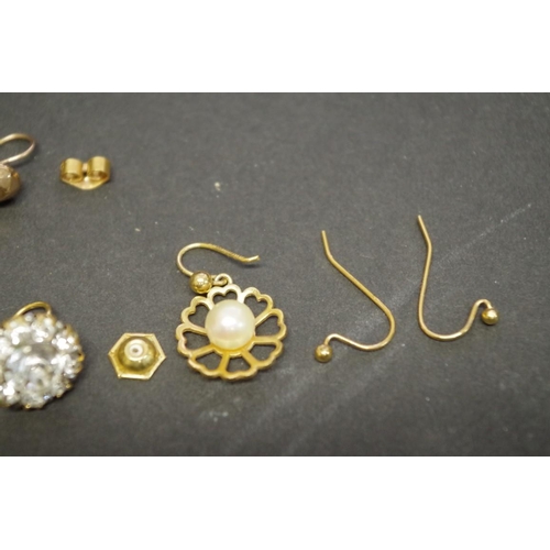 162 - A small parcel of gold and other earrings.