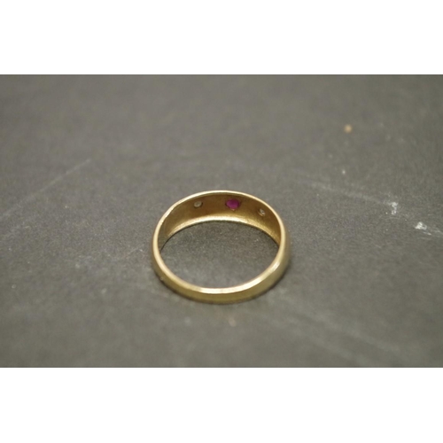 170 - Two 9ct gold gypsy set ruby rings; together with a pair of gold plated ear clips.