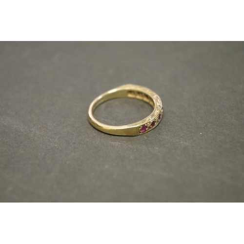 170 - Two 9ct gold gypsy set ruby rings; together with a pair of gold plated ear clips.