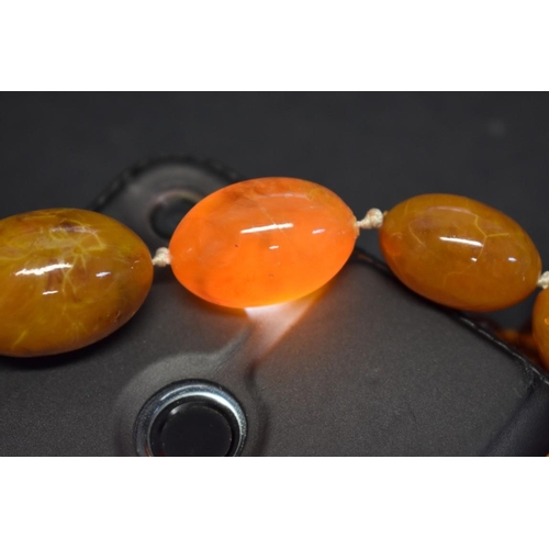 195 - Three strings of butterscotch amber style beads, 168g; together with another toffee amber style stri... 