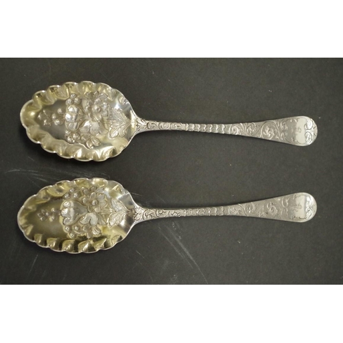 72 - A Georgian silver gilt berry spoon, by Hester Bateman, London 1780; together with a similar example,... 