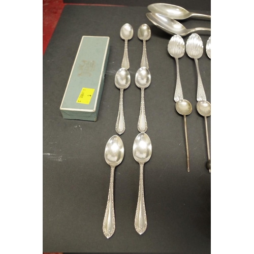 80 - A quantity of silver teaspoons; together with four mother of pearl handled silver knives; and three ... 