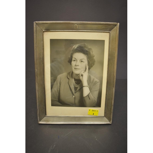 83 - An engine turned silver rectangular photograph frame, by Walker & Hall, Birmingham 1938?, 25cm x... 