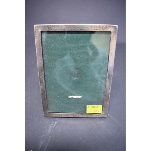 83 - An engine turned silver rectangular photograph frame, by Walker & Hall, Birmingham 1938?, 25cm x... 