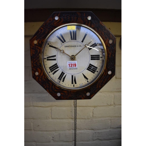 1319 - A Black Forest 30 hour wall clock, 32cm wide, with weights and pendulum. 