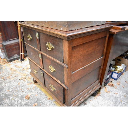 1335 - An antique oak panelled chest of drawers, 85.5cm wide. 