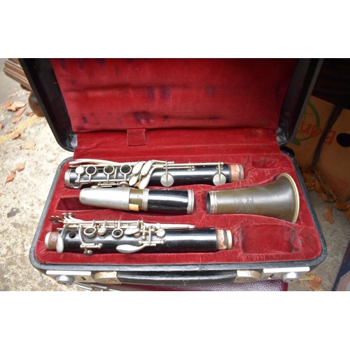 1339 - Three various clarinets, each boxed.