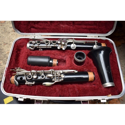 1339 - Three various clarinets, each boxed.