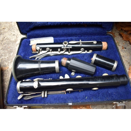 1339 - Three various clarinets, each boxed.