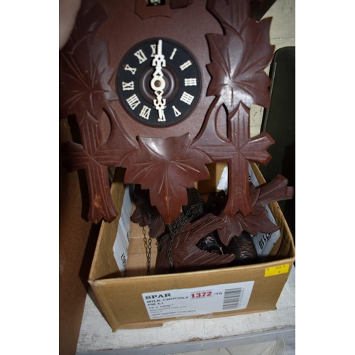 1372 - An old eight day cuckoo clock, with pine cone weights. 