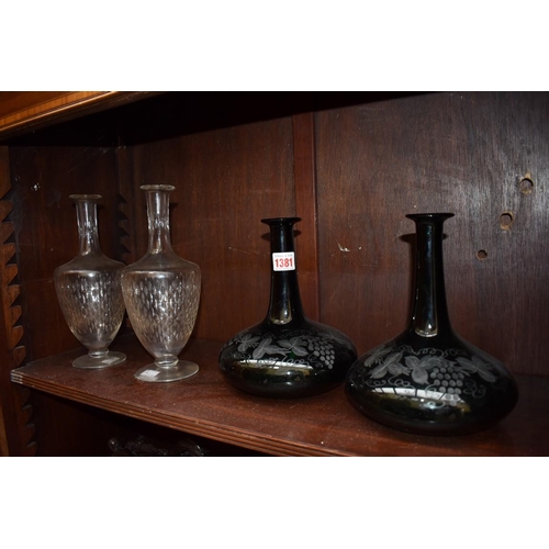 1381 - A pair of etched green glass decanters; together with another pair of clear glass decanters, (no sto... 