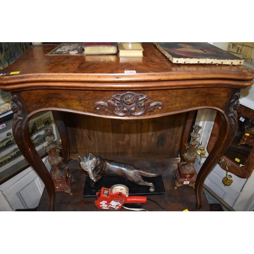 1388 - A Victorian figured walnut serpentine card table, 83cm wide.