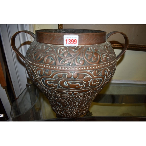 1399 - An Eastern embossed twin handled copper vase, 26.5cm high. 