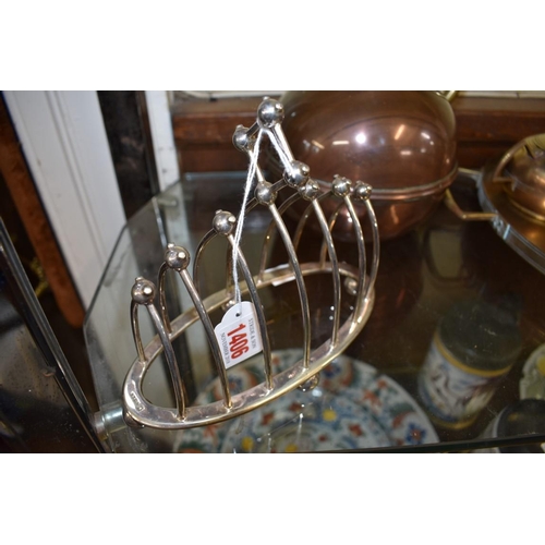 1406 - A Christopher Dresser style electroplated seven bar toast rack.  