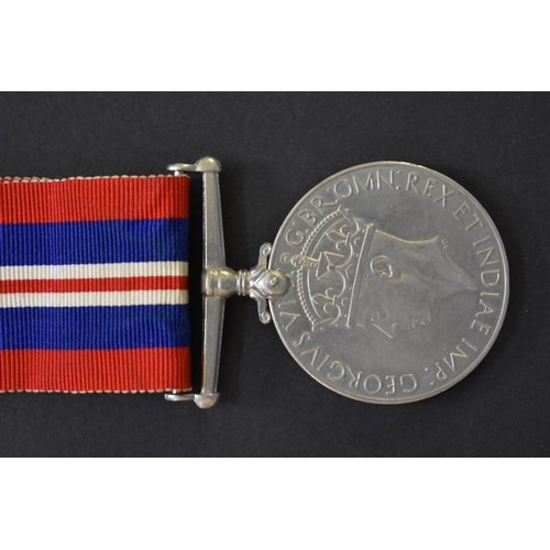 569 - Medals: a World War II group of three, comprising 1939-45 Star; War medal; and Defence medal; togeth... 