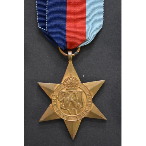 569 - Medals: a World War II group of three, comprising 1939-45 Star; War medal; and Defence medal; togeth... 