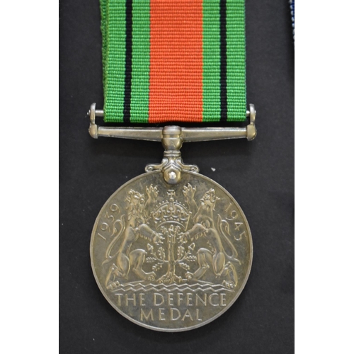 569 - Medals: a World War II group of three, comprising 1939-45 Star; War medal; and Defence medal; togeth... 