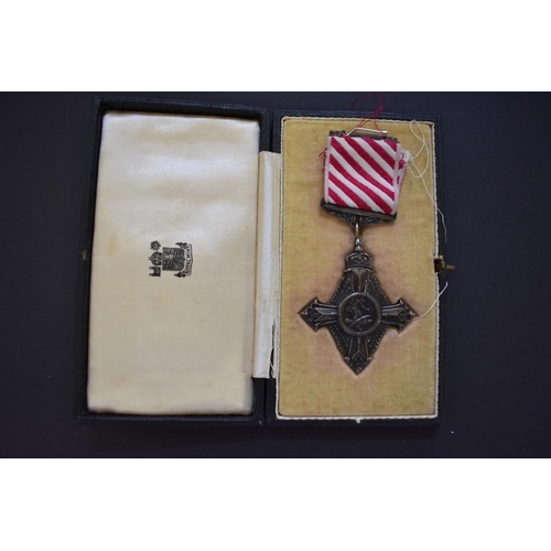 571 - Medals: an Air Force Cross, boxed; together with a miniature group of eight to Group Capt. E.R. Open... 