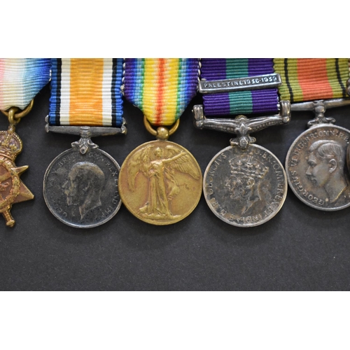 571 - Medals: an Air Force Cross, boxed; together with a miniature group of eight to Group Capt. E.R. Open... 