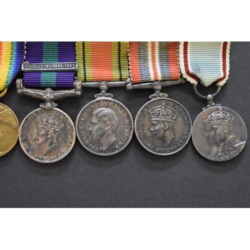 571 - Medals: an Air Force Cross, boxed; together with a miniature group of eight to Group Capt. E.R. Open... 