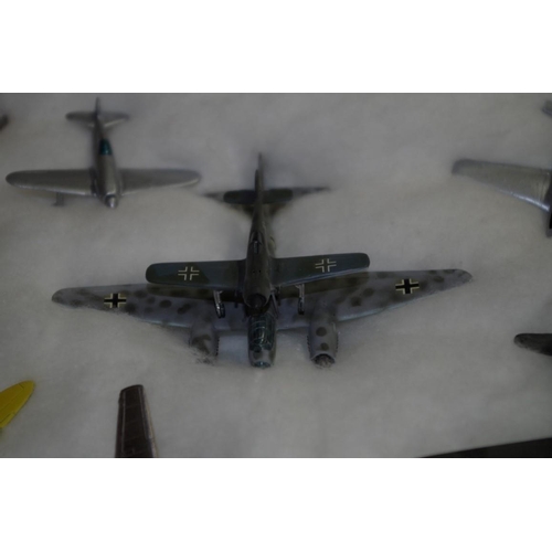 654 - A collection of diecast and resin planes. (38)