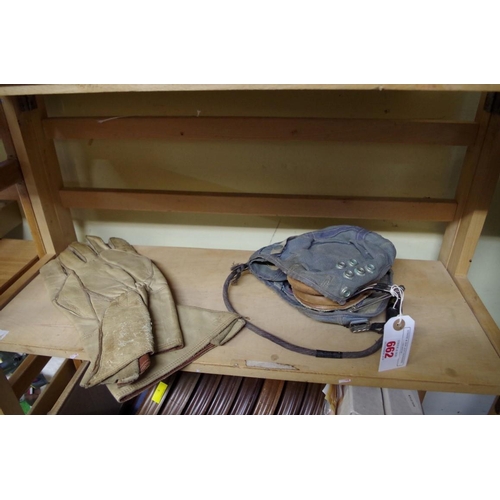 662 - An RAF pilot's cloth helmet; together with a pair of World War II leather gauntlets, with broad arro... 