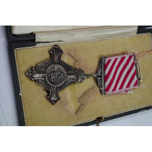 571 - Medals: an Air Force Cross, boxed; together with a miniature group of eight to Group Capt. E.R. Open... 