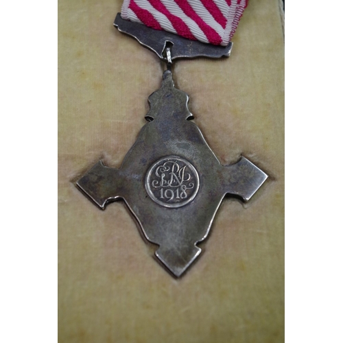 571 - Medals: an Air Force Cross, boxed; together with a miniature group of eight to Group Capt. E.R. Open... 