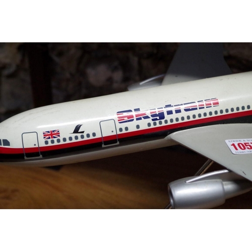 1057 - A model of a Laker A300 'Skytrain' aeroplane, wingspan 46cm, on stand.