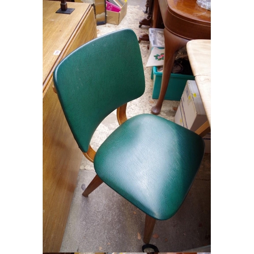 1115 - A vintage Ercol stripped elm and beech drop leaf dining table, 136cm extended; together with a pair ... 