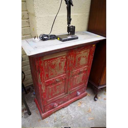 1133 - A painted hardwood small cabinet, with a pair of fielded panel doors above an apron drawer, 73cm wid... 