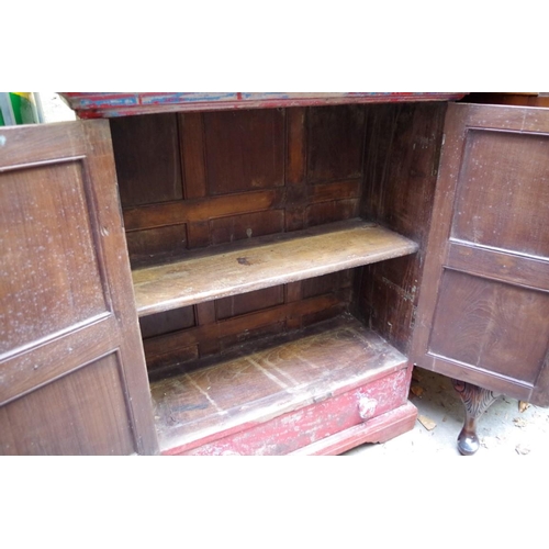 1133 - A painted hardwood small cabinet, with a pair of fielded panel doors above an apron drawer, 73cm wid... 