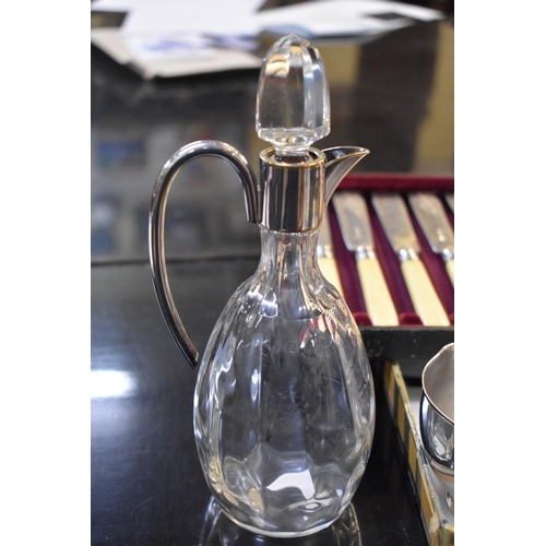 195 - An EPNS mounted glass carafe and other plate.