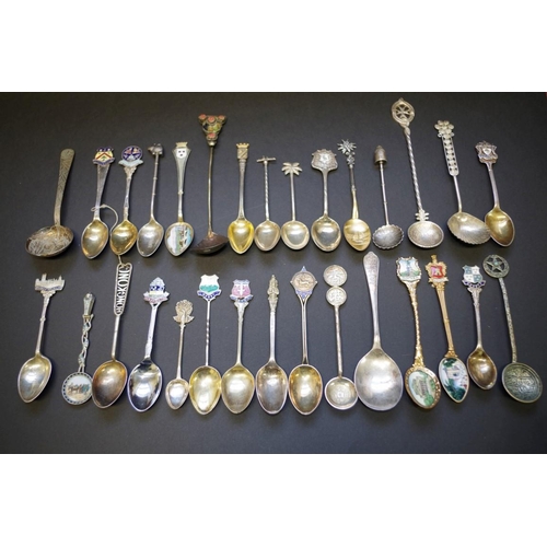 26 - A collection of souvenir teaspoons, to include some silver examples.