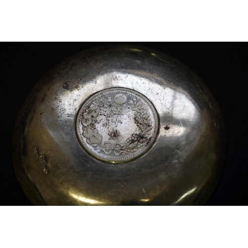 43 - A Japanese .90 silver pin dish inset coin; together with eight metal animal place name holders; a me... 