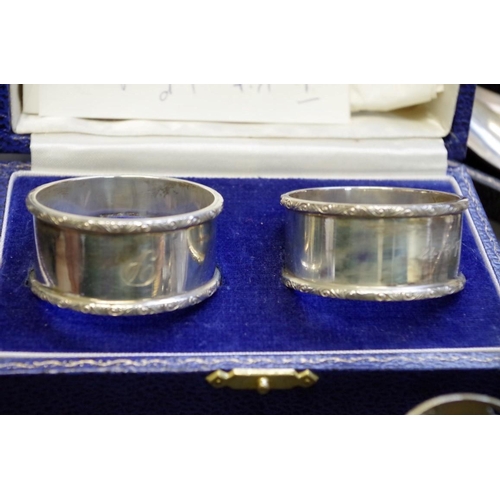 62 - A cased pair of silver napkin rings, by S.J Rose & Son, Birmingham 1973; together with two cased... 